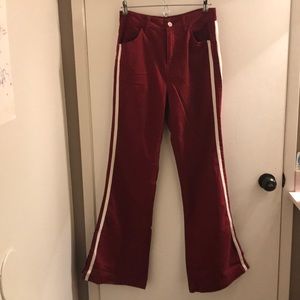 red flare jean with two white stripes on sides